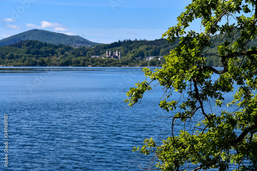 The Benedictine monastery in Maria Laach with the Laacher See on a beautiful spring day photo