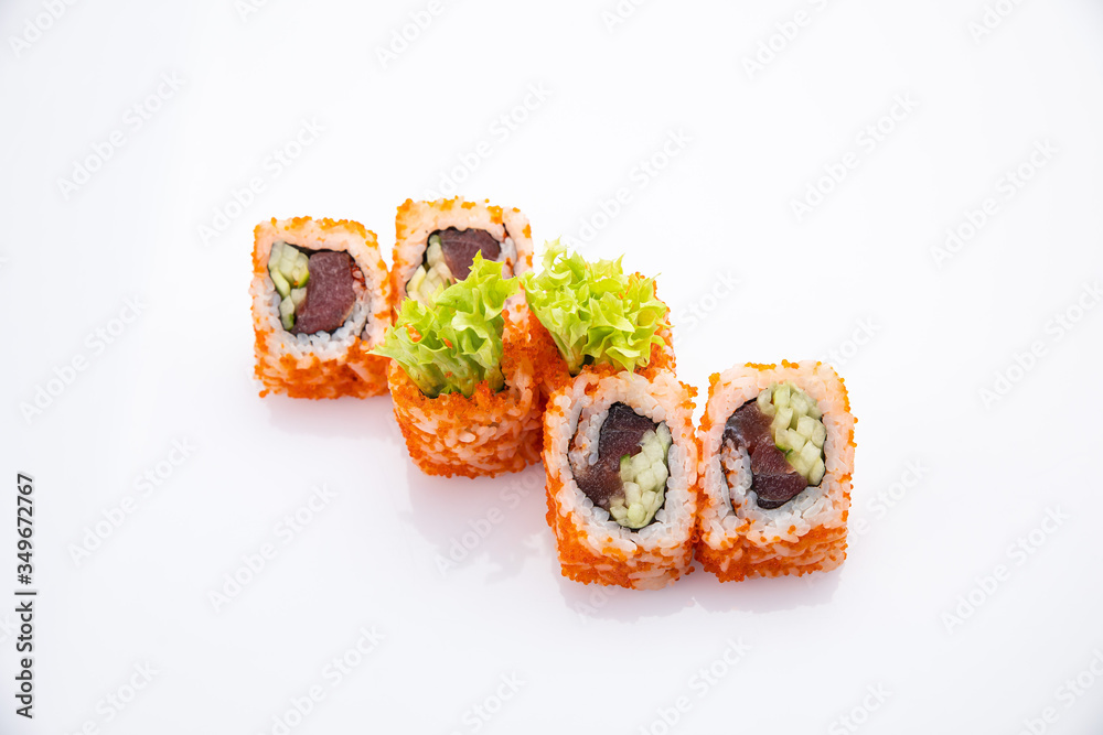 Japanese cuisine. Sushi roll on white background. Japanese cuisine. Sushi roll on white background.