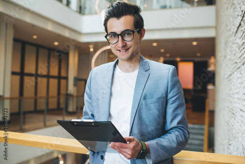 Vászonkép Half length portrait of cheerful caucasian male executive manager satisfied with