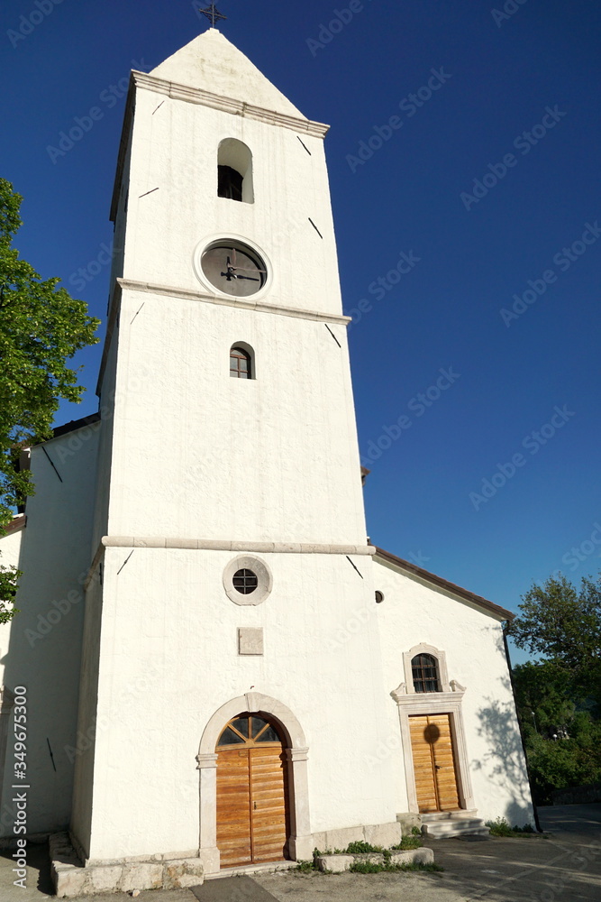 Restored baroque church with a bell tower in the Drivenik, Croatia