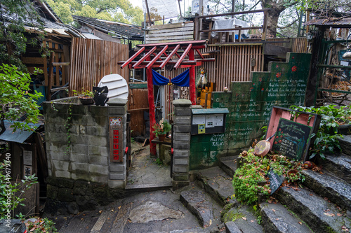 Neko-no-Hosomichi Cat Alley in Onomichi City. Lots of real and ornamental cats (fukuishi-neko), quaint cafes and galleries on this narrow street. Hiroshima Prefecture, Japan photo