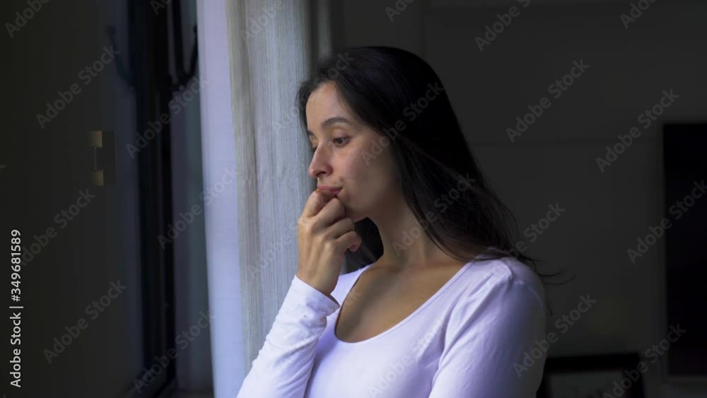 Side view of young thoughtful caucasian lady looking through window at home. Pretty woman feeling loneliness and sadness during leisure time.
Side view of young thoughtful caucasian lady looking through window at home. Pretty woman feeling loneliness and sadness during leisure time.