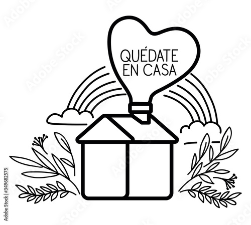 Quedate en casa text with house rainbow heart and leaves vector design