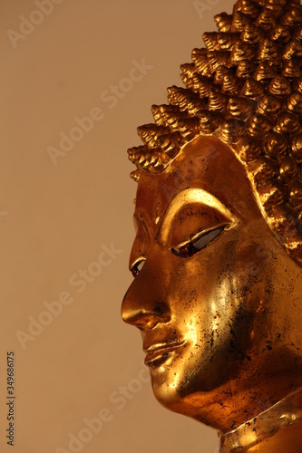 Golden sculpture of Buddha, inside the Grand Palace complex in Bangkok, Thailand