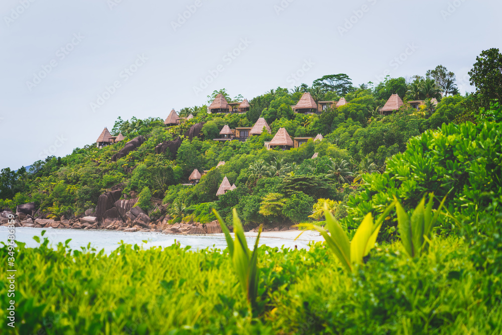 Luxury resort near tropical sandy coast on Seychelles islands. Mahe, Anse Marie-Louise beach