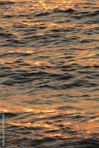 Beautiful ocean waves, lit by sunset light.