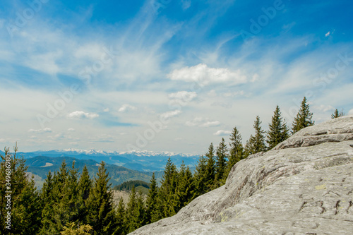 Panoramic view of picturesque Carpathian Mountains landscape with forest slopes, mountain ranges and peaks. Holidays in the mountains. photo