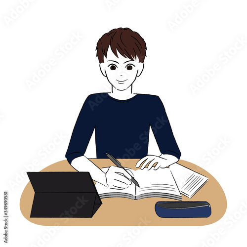 タブレットを見ながら勉強する男子学生