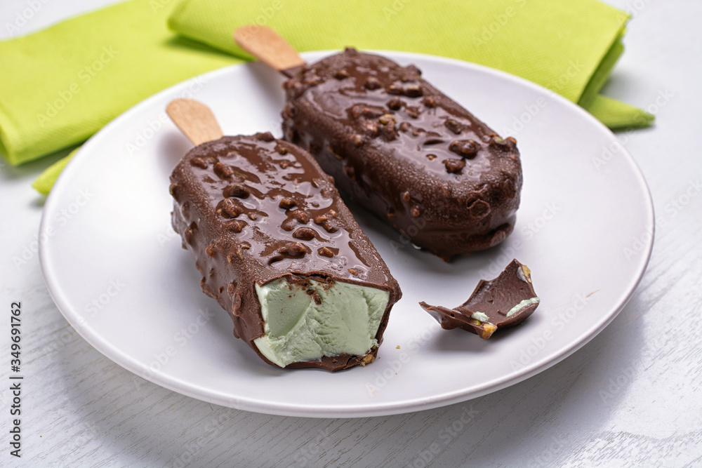 chocolate ice cream filled with pistachio cream - closeup chocolate ice cream filled with pistachio cream - closeup