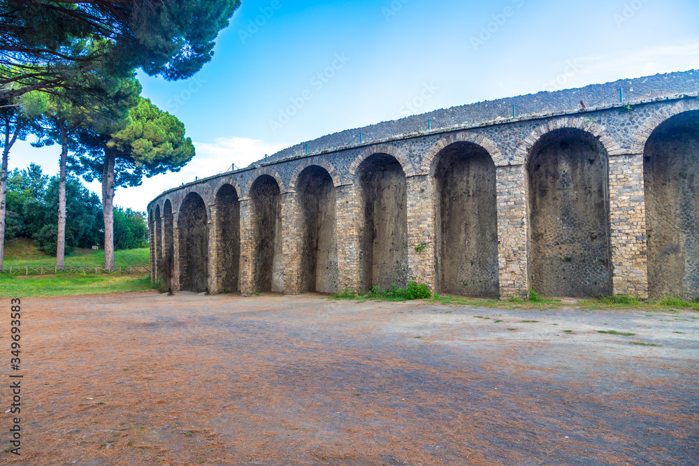 Obraz premium Pompeii in Italy, ruins of the antique Temple of Apollo with bronze Apollo statue, Naples.