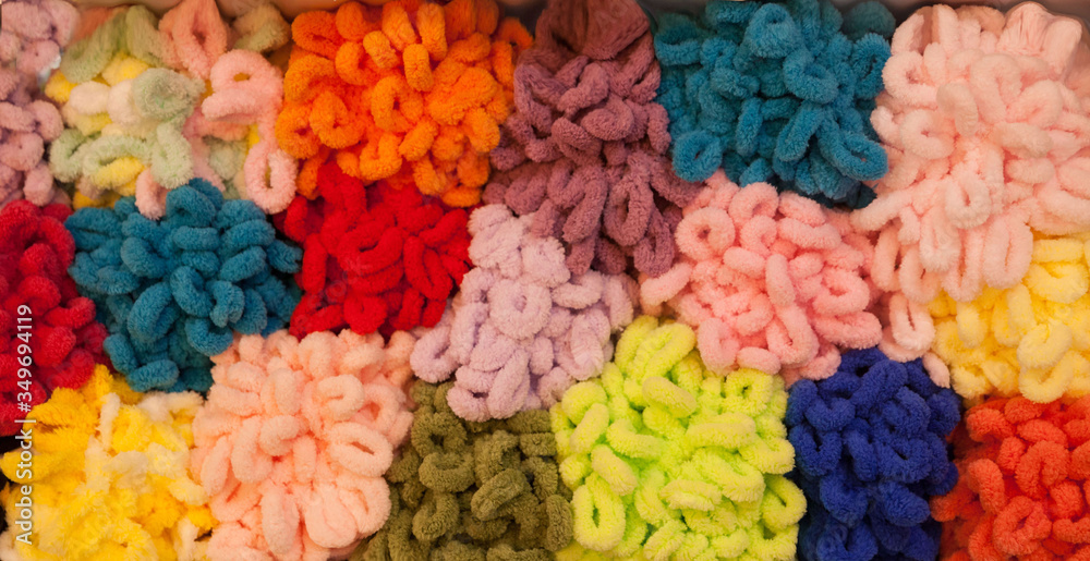 Colorful Balls Of Wool On Shelves. Variety of knitting yarns.