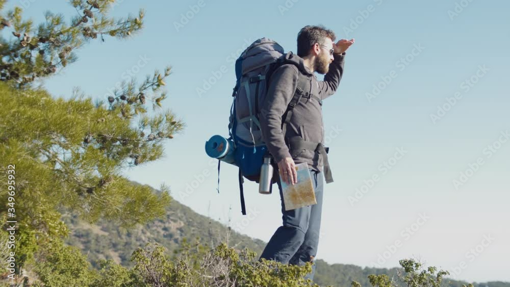 Lost man holding map during traveling on mountain Lost man holding map during traveling on mountain