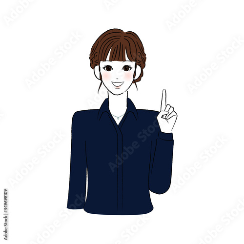 笑顔で指をさすシャツを着た女性