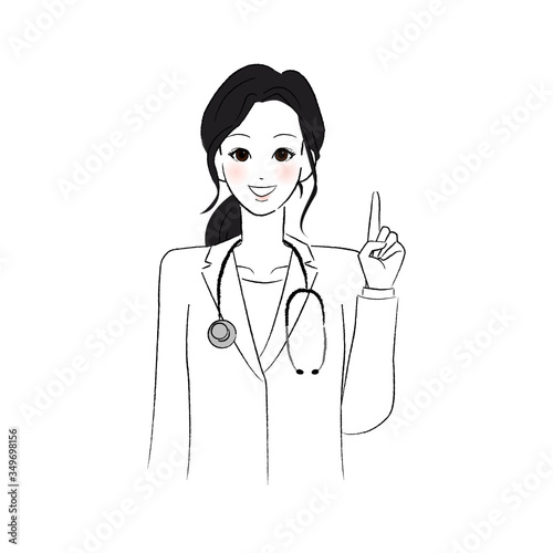 笑顔で指をさす女性医師