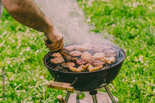 grilled sausages and chicken on the grill