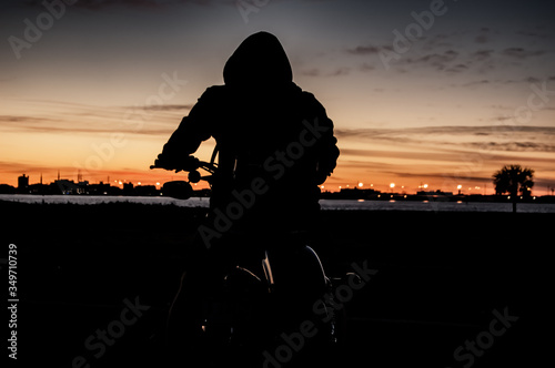 silhouette of a man on motorcycle