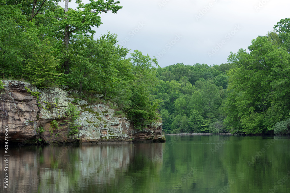 Large boulders with trees on a lake. Large boulders with trees on a lake.
