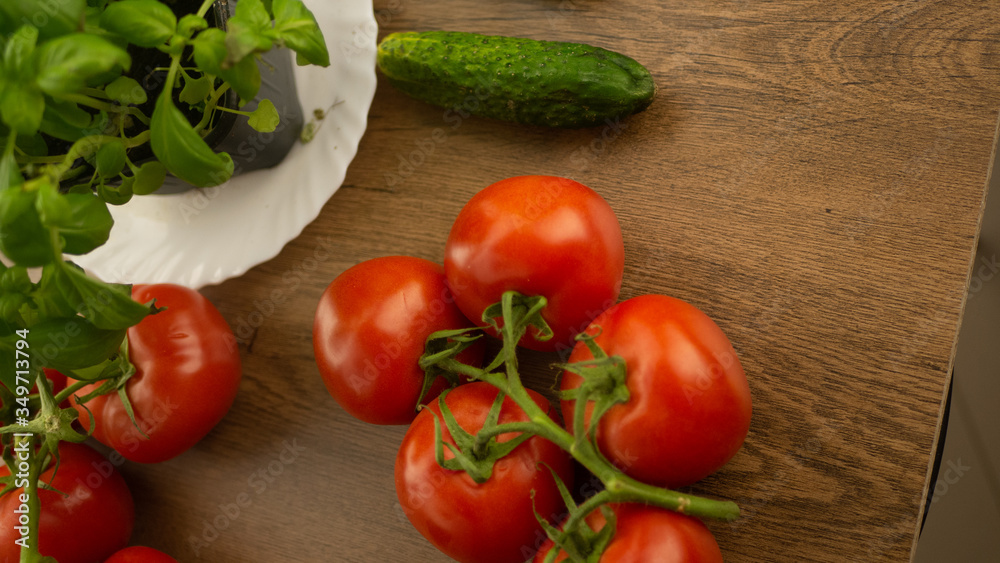 Vegetables. Tomatoes and cucumbers with basil. Ready free entry space
Vegetables. Tomatoes and cucumbers with basil. Ready free entry space