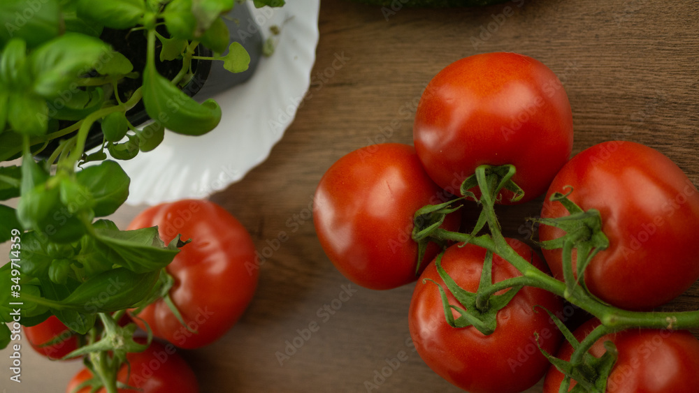 
Vegetables. Tomatoes and cucumbers with basil. Ready free entry space