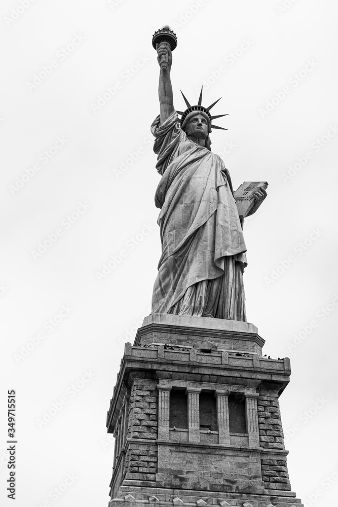 Fototapeta premium Statue of Liberty In New York Against A White Sky