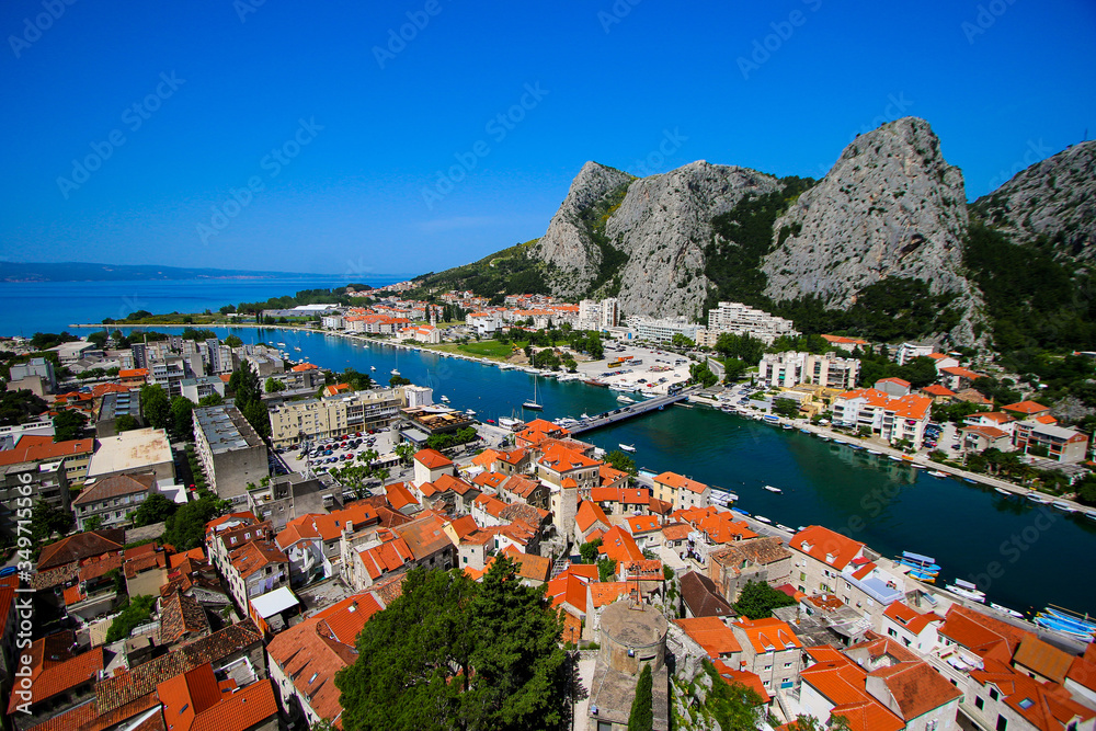 Aerial view of the mouth of the Cetina River in Omis, Croatia - Old village by the mountains with a famous canyon