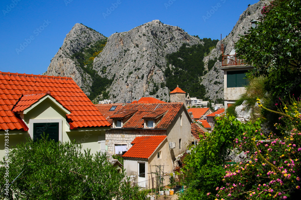 Rooftops of Omis in Croatia - Small seaside dalmatian village at the bottom of the mountains of the Makarska riviera