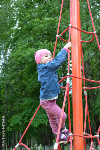 A girl is playing on the Playground