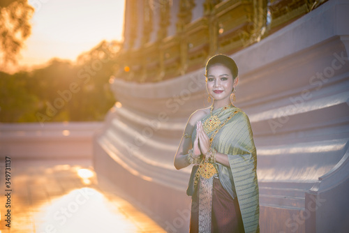 Thai women wear beautiful Thai clothes and show their gestures with respect. Culture concepts.