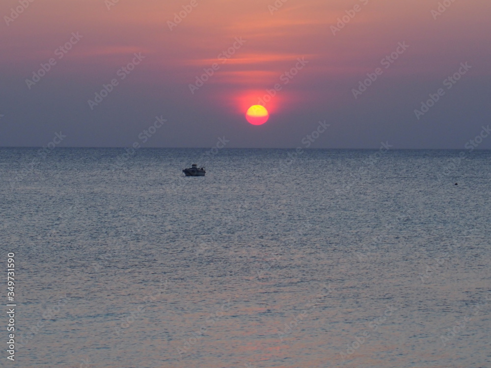 Fototapeta premium Beautiful sunset with a ship, Nungwi, Zanzibar, Tanzania