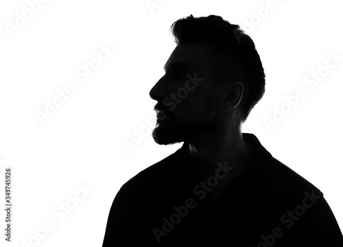 Silhouette of male person over white