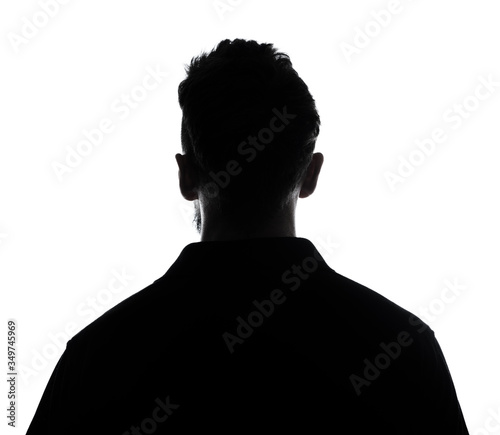 Silhouette of male person , back view back lit over white