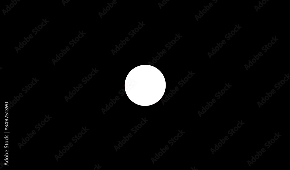 Light from a round lamp in the dark.