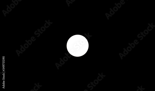 Light from a round lamp in the dark.