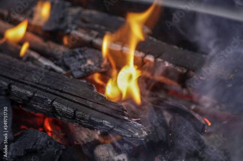 Coals burn in a fire. Fire.