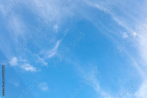Blue sky with white clouds texture and background. © ADSKrongsawat