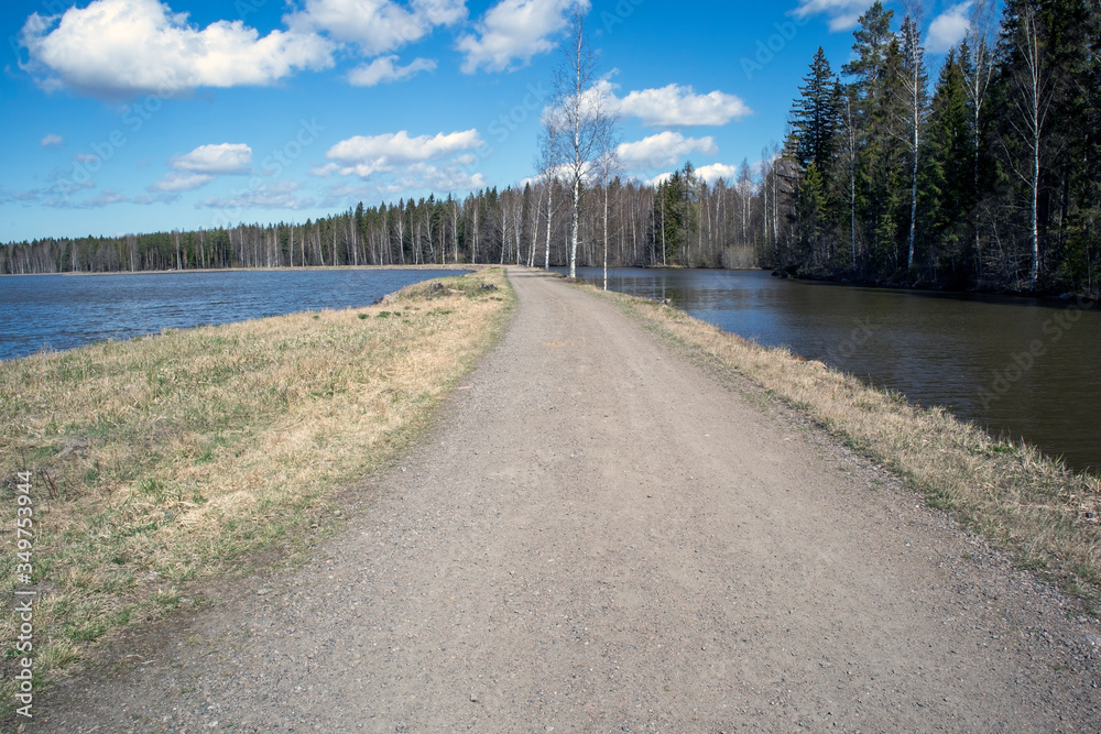 Fototapeta premium narrow dirt road by the Saimaa canal, Lappeenranta Finland