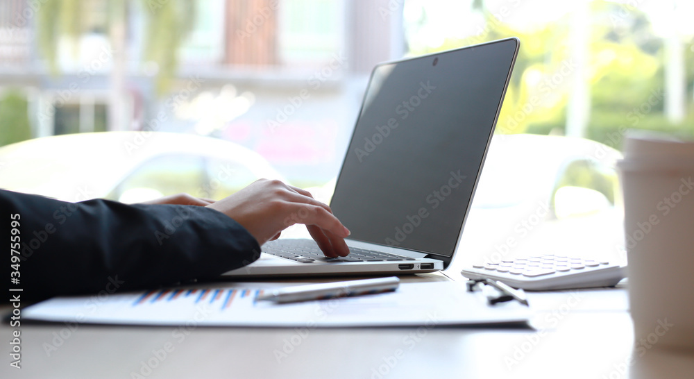 The world of technology and internet communication, Financial professionals use laptop to calculate and check real estate earnings, Finance and Tax Technology concept. The world of technology and internet communication, Financial professionals use laptop to calculate and check real estate earnings, Finance and Tax Technology concept.