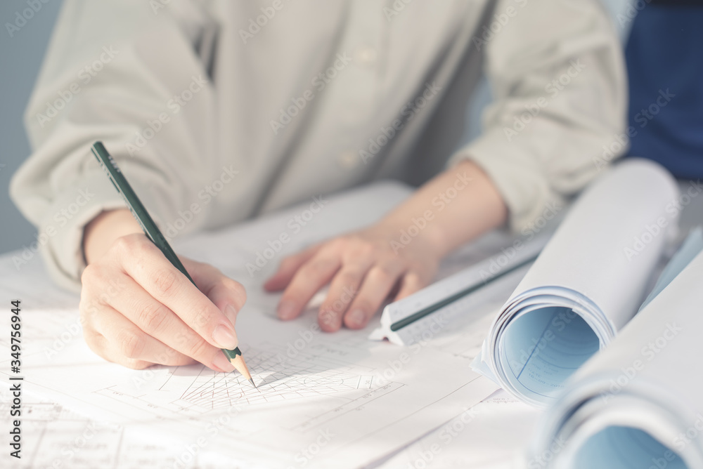 Architect working on blueprint. Architects workplace - architectural ...