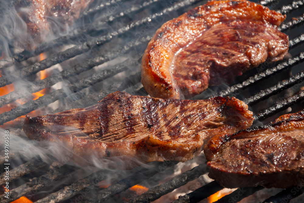 Cut of beef prepared charcoal outdoors Christmas party in Latin America, natural light. Cut of beef prepared charcoal outdoors Christmas party in Latin America, natural light.