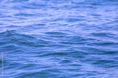Selective focus of the Wave on the water surface in the Gulf of Thailand. The strong wind caused waves on the surface of the sea. Can use for addtext and abstract background. © witsawat