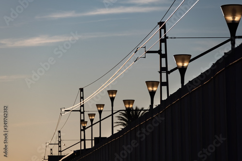 Lanterns of the railway station at the sunset. photo