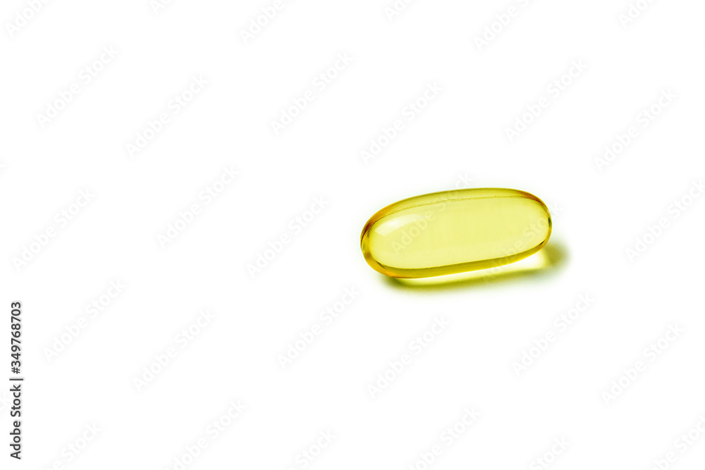 Yellow pill isolated on a white background Yellow pill isolated on a white background