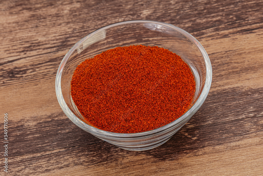 Dry paprika powder in the bowl Dry paprika powder in the bowl