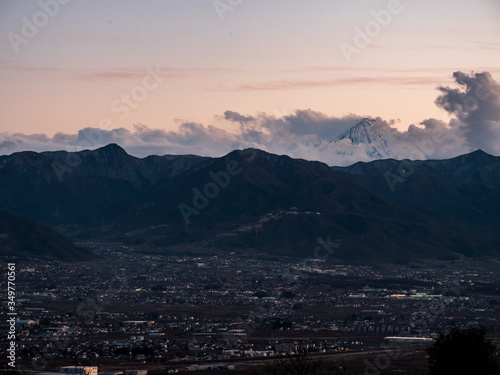 Views of Koufu city and the surrounding mountains at sunset photo