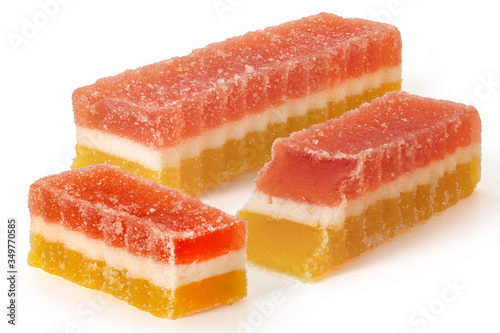 Three marmalade fruit candies on white background