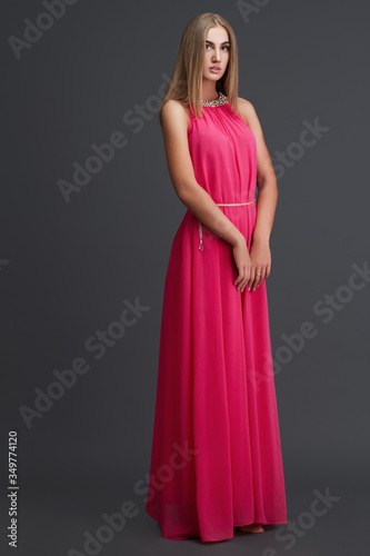 girl in dress posing in studio