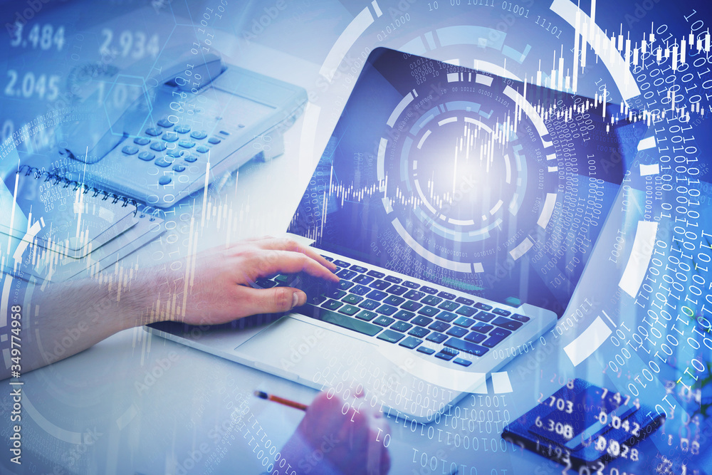Businessman using laptop, financial HUD interface Businessman using laptop, financial HUD interface