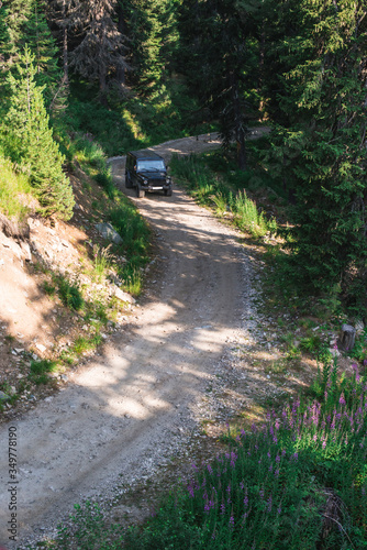 Offroad car on a mountain road