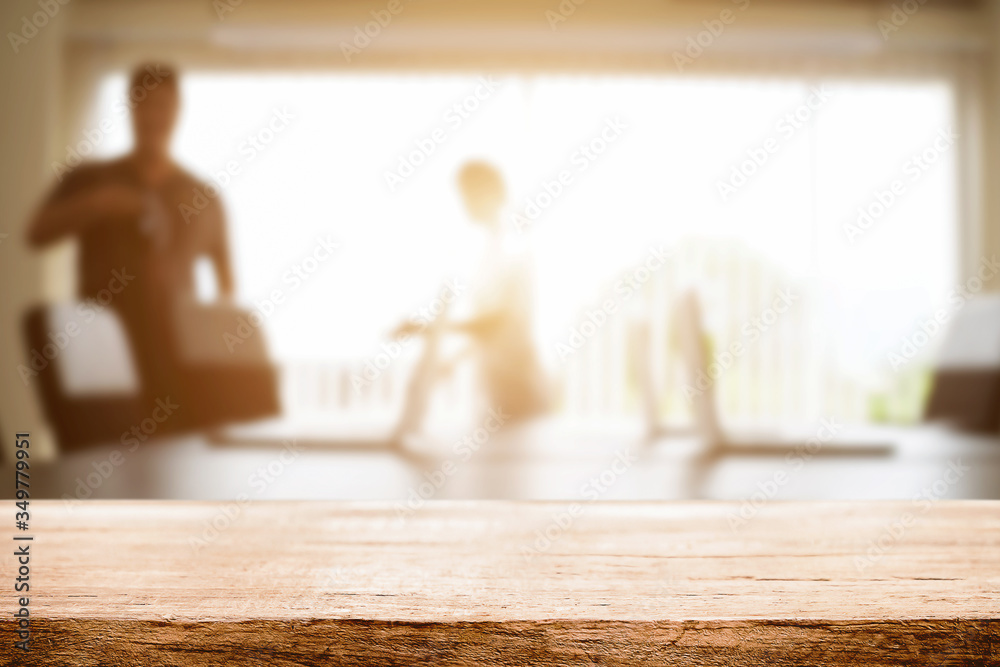 Empty wooden desk space over blurred office or meeting room background. Product display. Empty wooden desk space over blurred office or meeting room background. Product display.