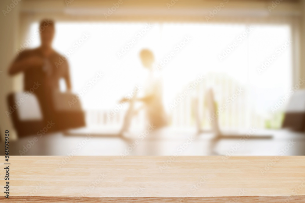 Empty wooden desk space over blurred office or meeting room background. Product display. Empty wooden desk space over blurred office or meeting room background. Product display.
